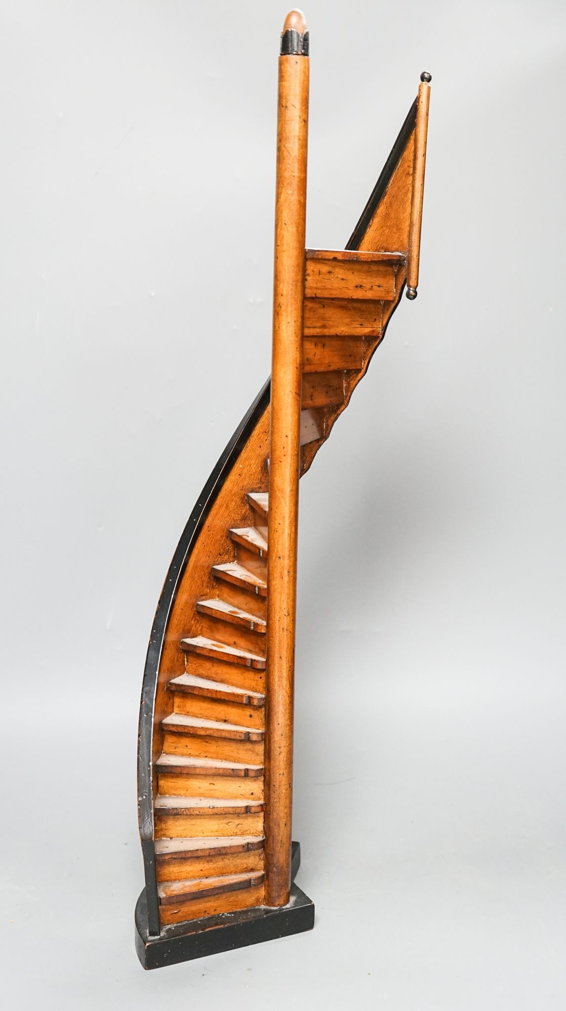 A reproduction fruitwood model spiral staircase 62cm